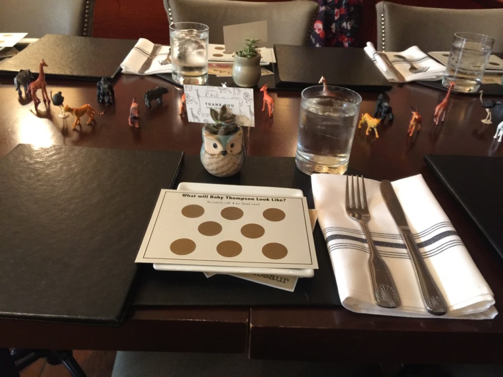 Table settings including Baby Shower Scratch Off Game