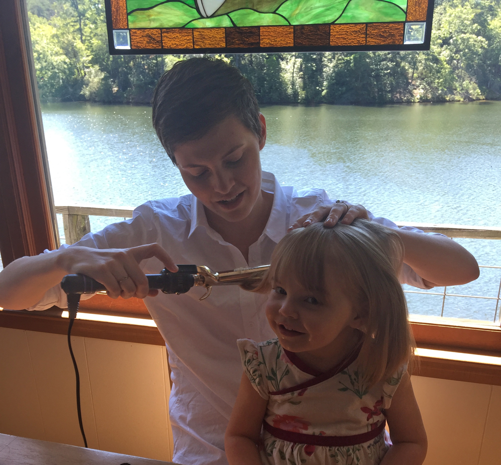 Mother and daughter in cabin by the lake