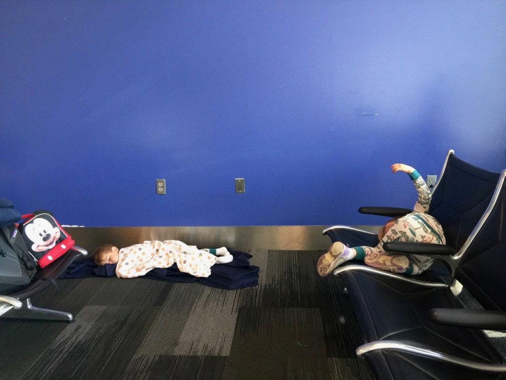 K sleeping in the airport after a red-eye