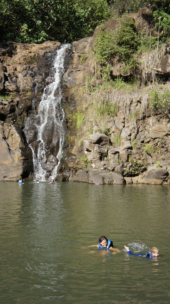 Swimming in Waimea Falls with toddler