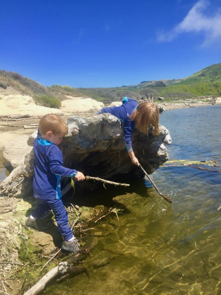HJ and K on the tree trunk